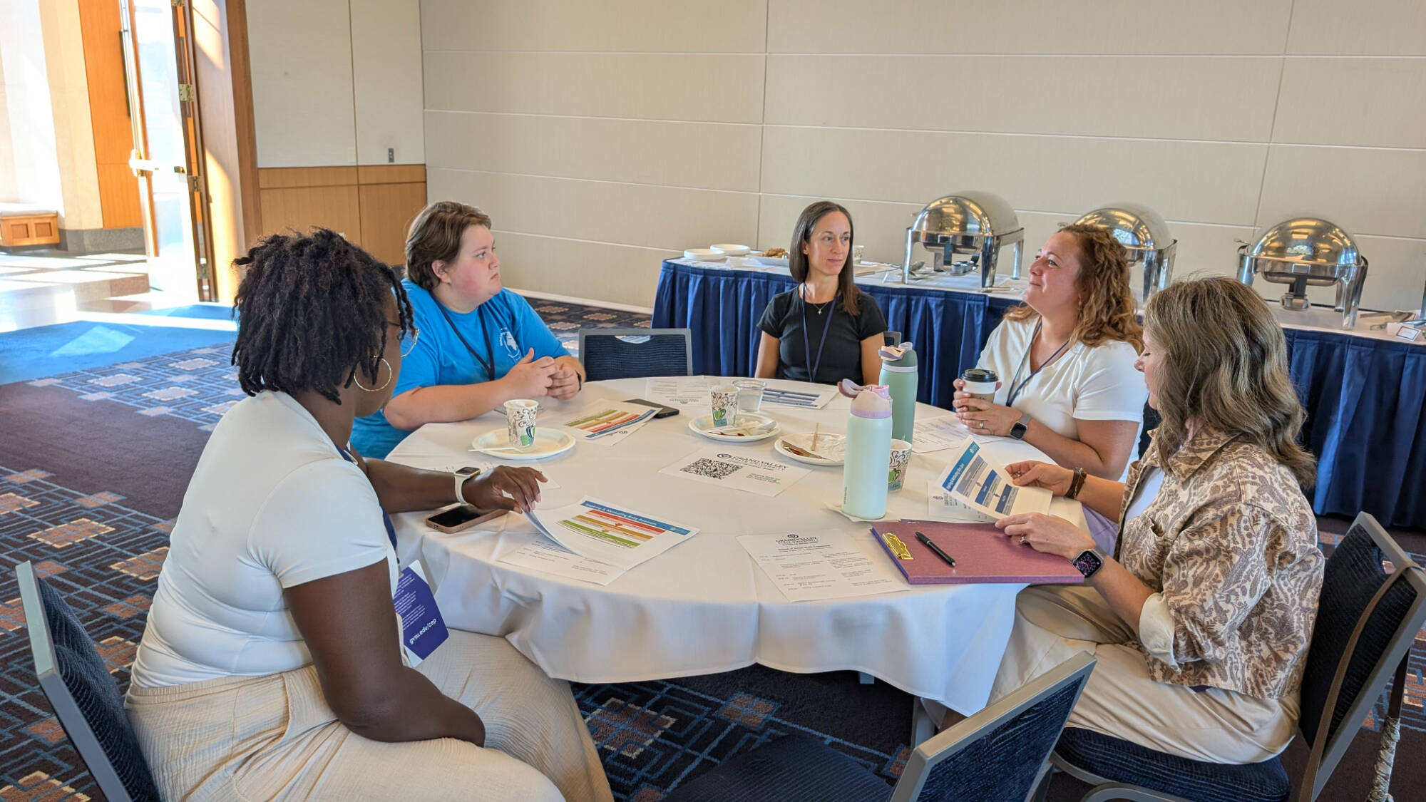 Attendees at the Social Work Convening participate in a small-group discussion.